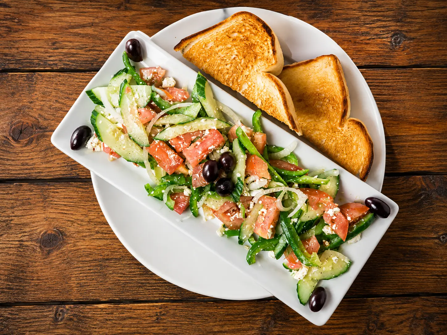Fresh salad and appetizer plate at Fourth Street Pizza Calgary